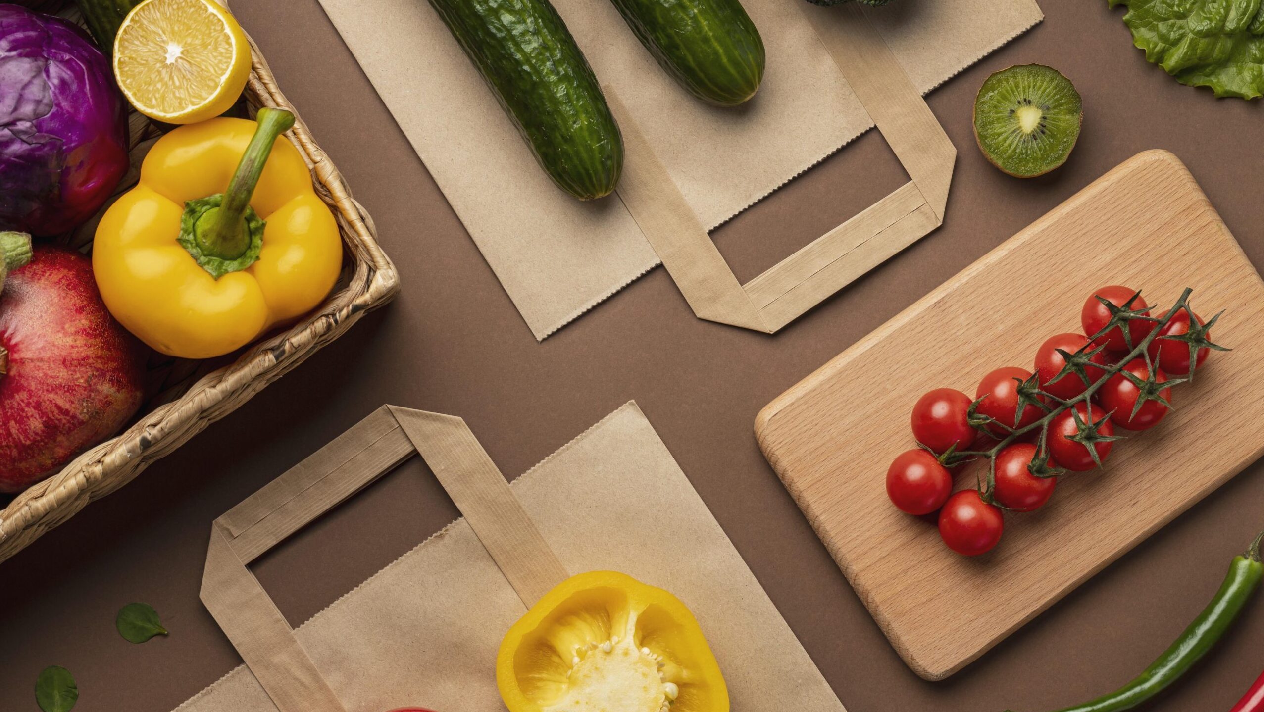 flat-lay-of-basket-of-organic-vegetables-with-grocery-bag